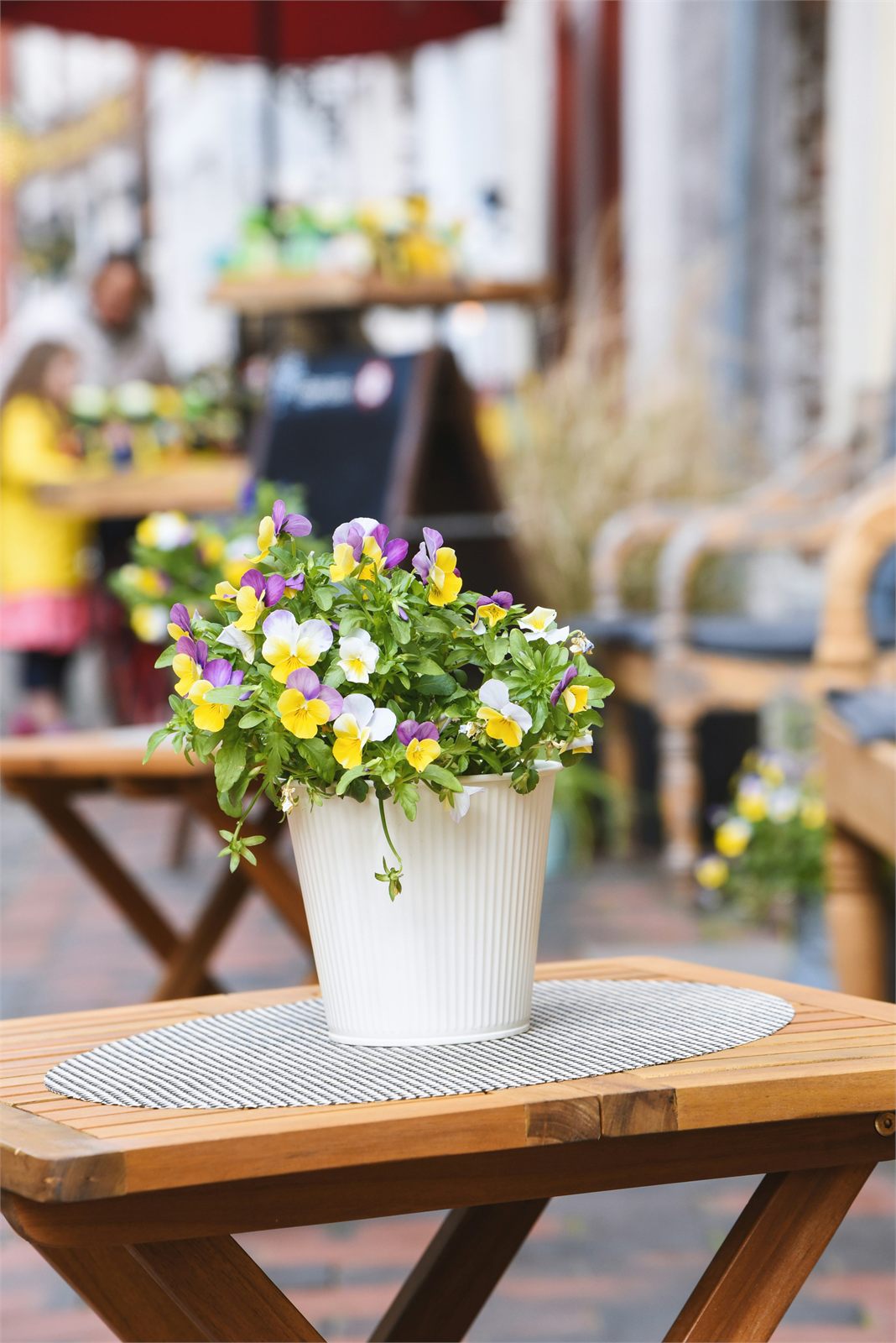 Indoor floral styling on a cafe table